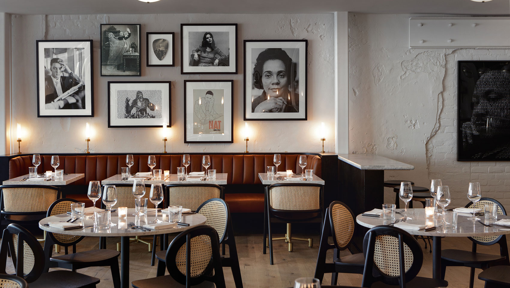 King Brasserie dining area tables and photos on wall
