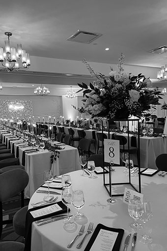 black and white image of reception set up in ballroom at Kimpton Hotel Fontenot