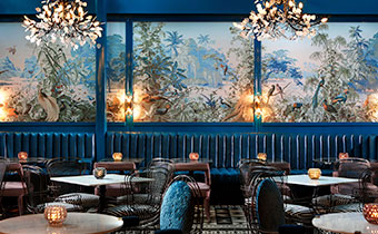 seating in the Peacock Room restaurant at Kimpton Hotel Fontenot